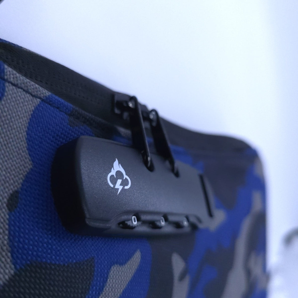 Smell proof crossbody bag top latch with FireBar Labs emblem on black lock