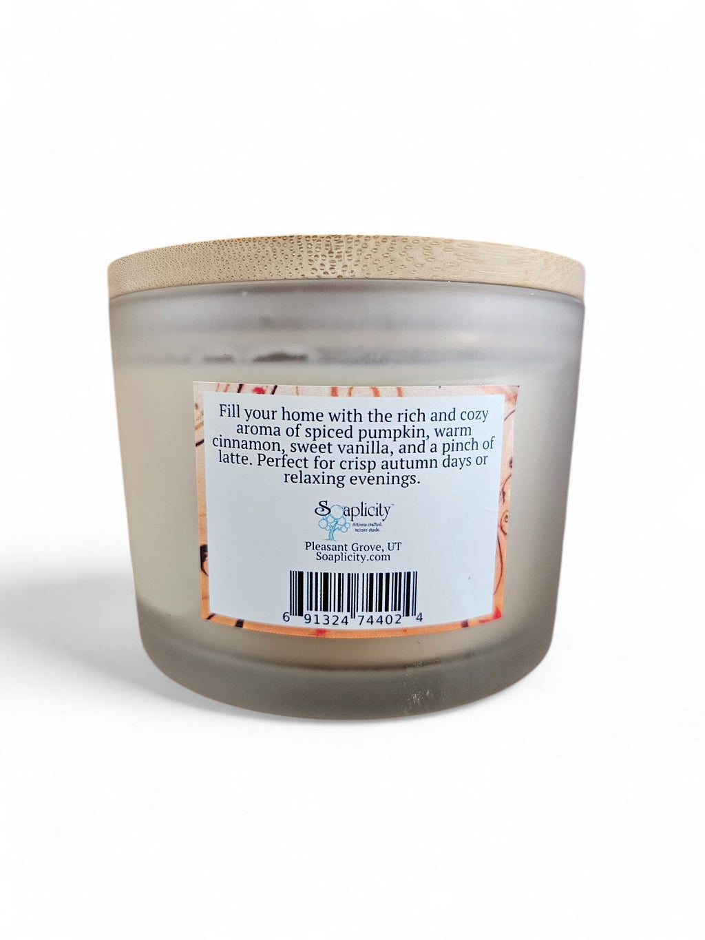 Coconut-soy pumpkin spice latte candle in frosted gray jar with back label, lid on
