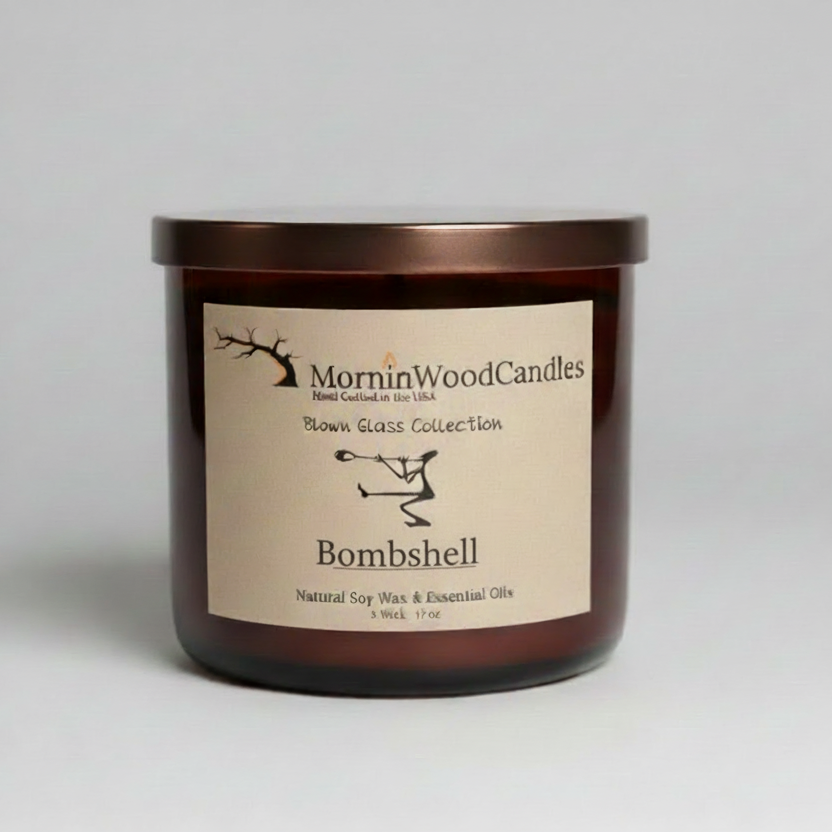 Amber blown-glass jar candle with centered Bombshell label and 3-wick text