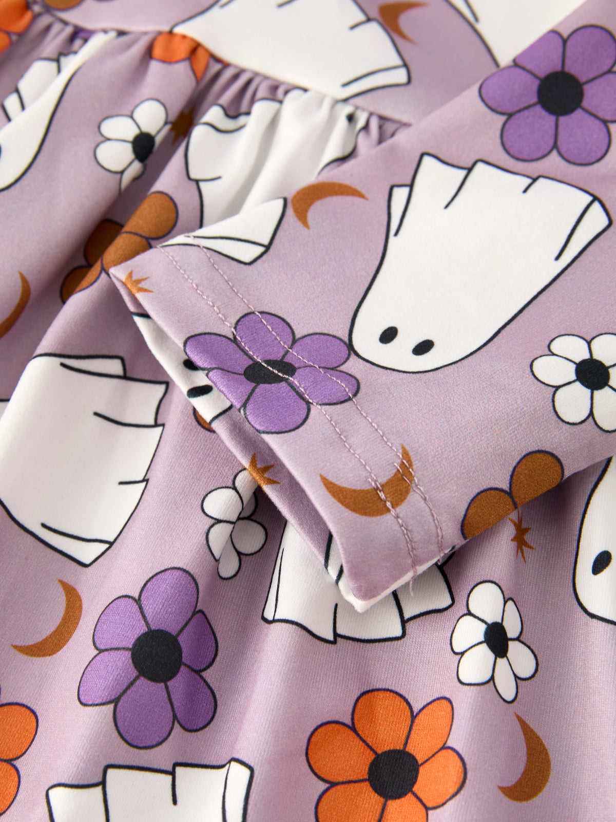 Girls' ghost print Halloween dress fabric with white ghosts and orange/purple flowers