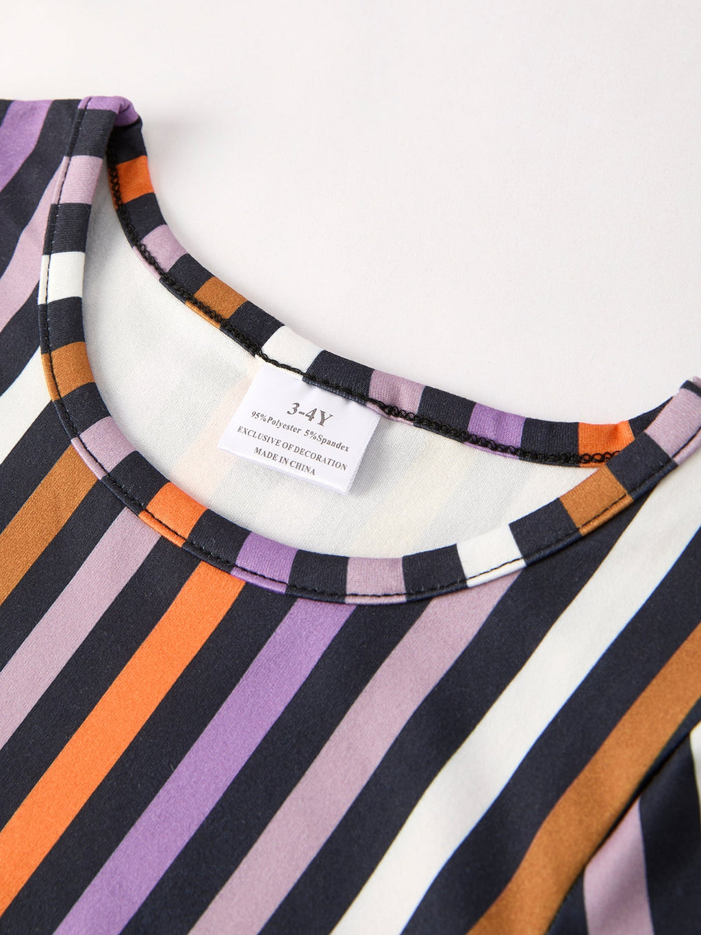 Girls' striped Halloween dress neckline with contrast trim and centered fabric tag