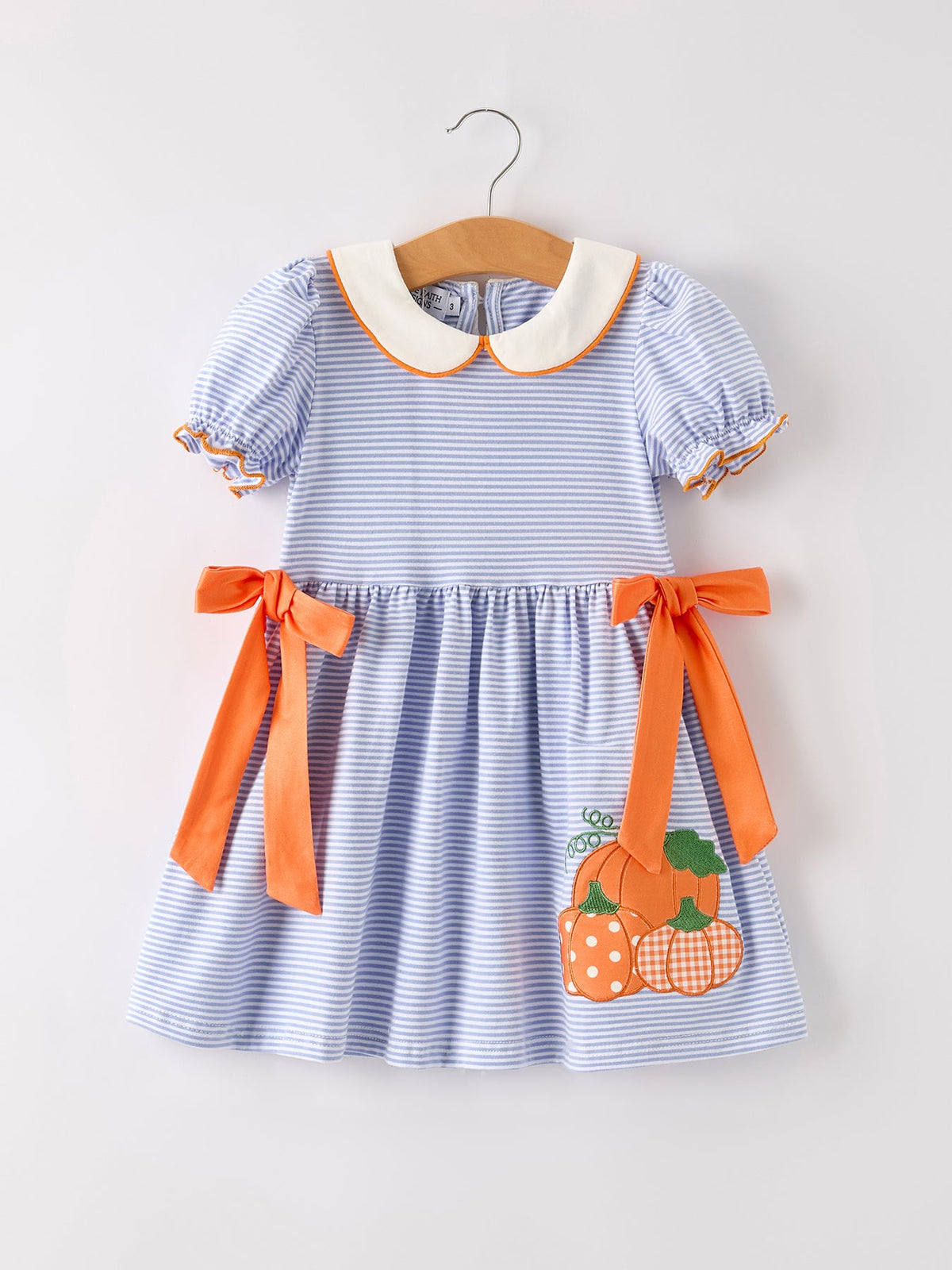 Girls striped dress with orange bow ties and pumpkin applique