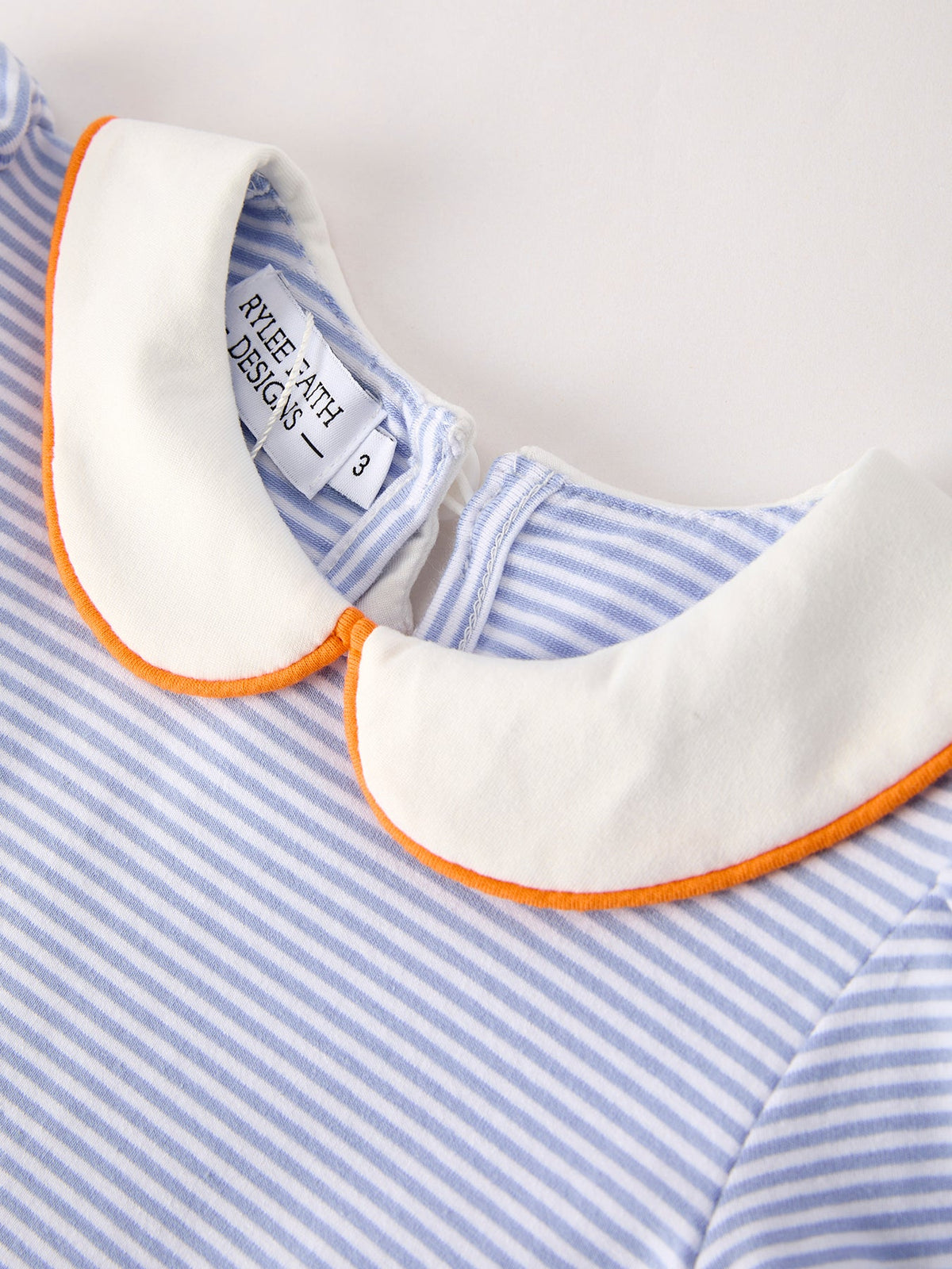 Girls striped dress with white peter pan collar and orange edge trim