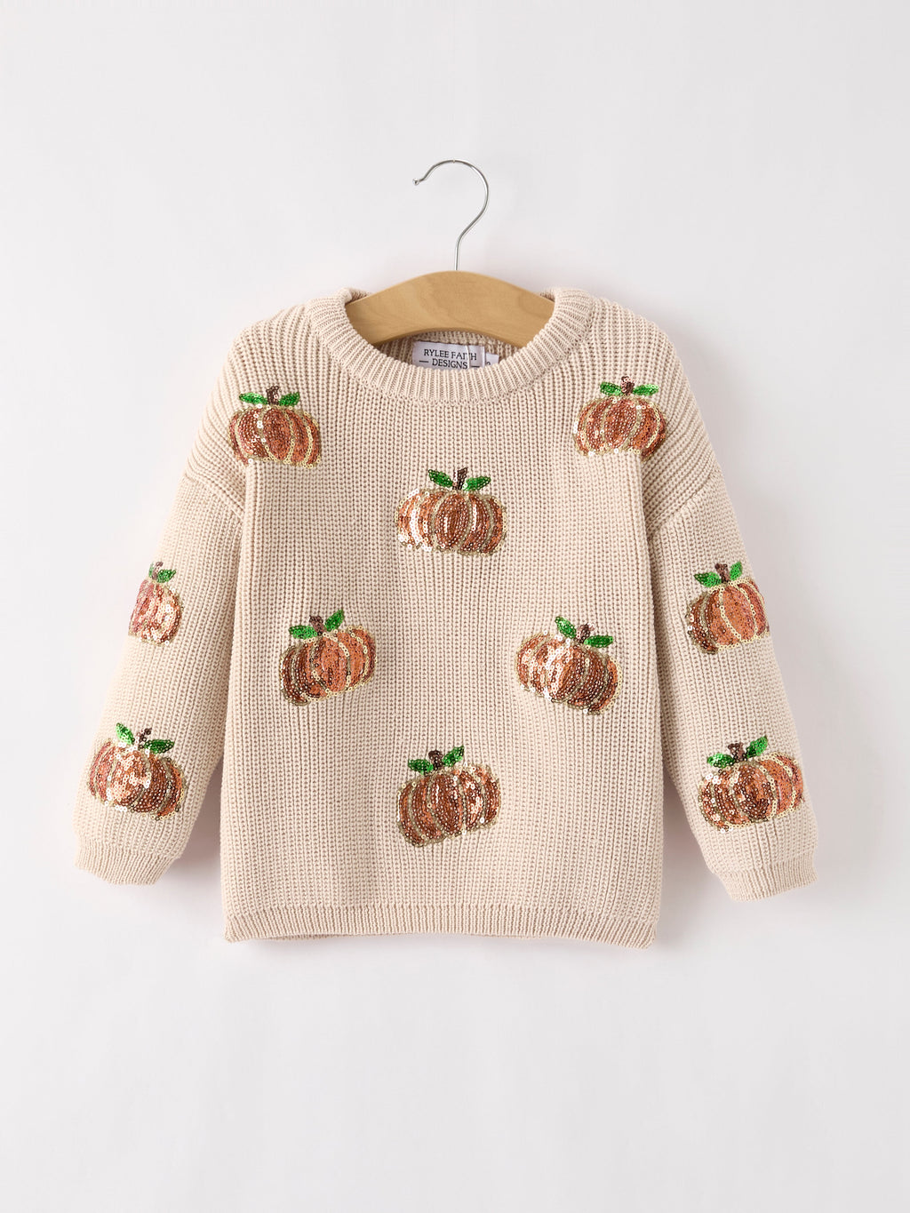 Beige knit pullover sweater with sequined pumpkins and long sleeves