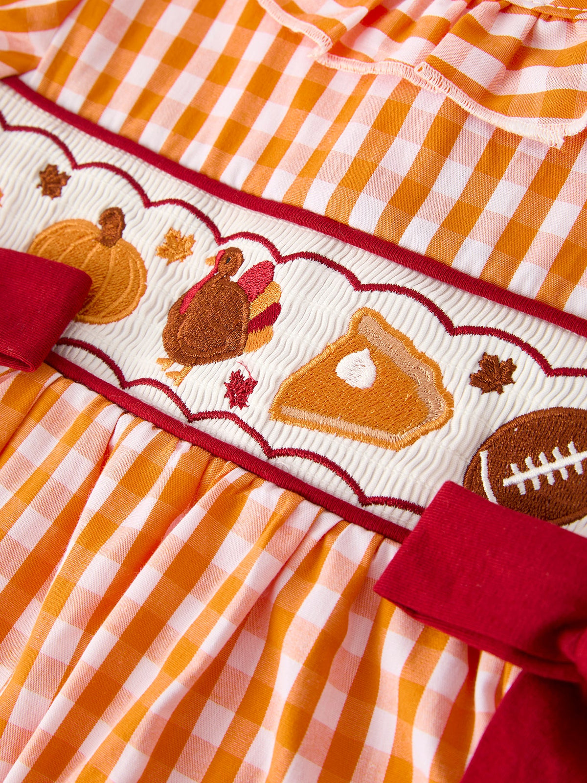 Girls orange checkered dress with embroidered turkey motif and red trim