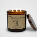 Amber blown-glass 3-wick soy candle with centered label