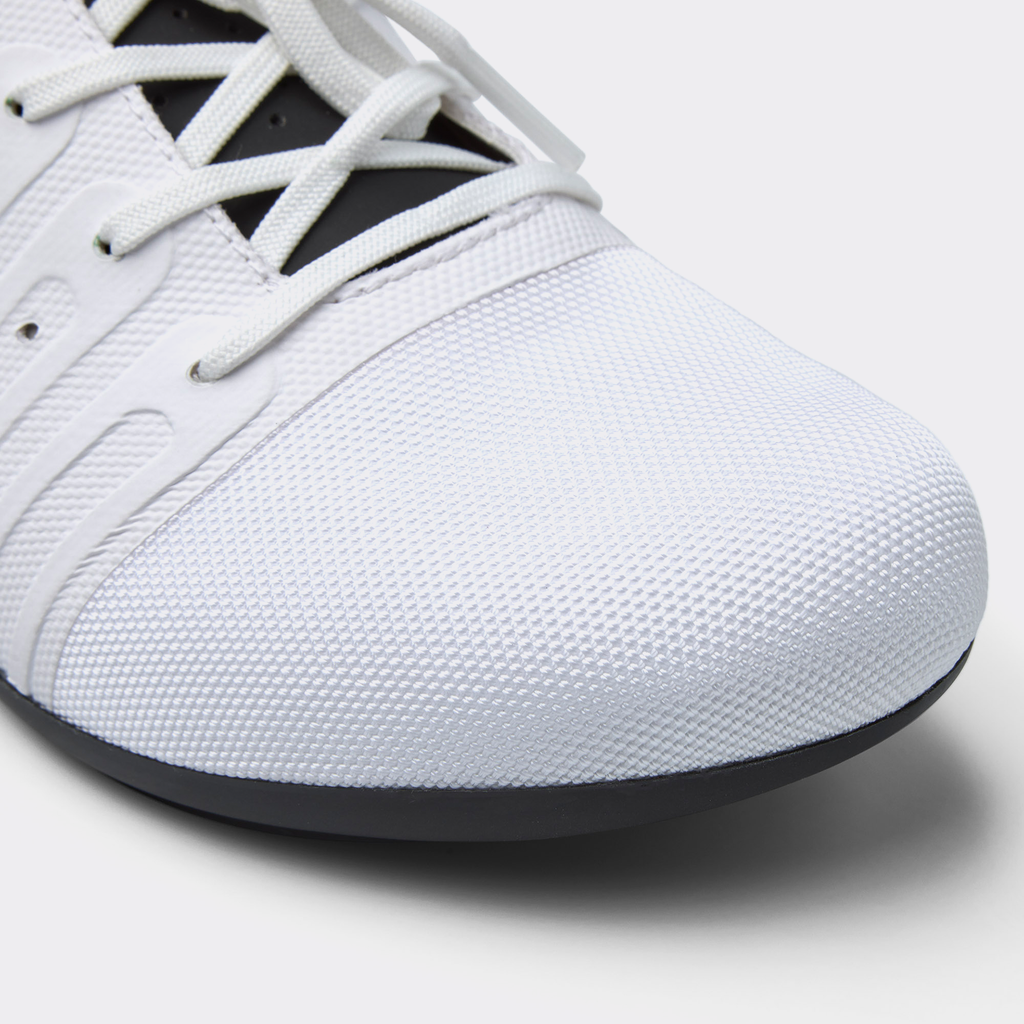 White road cycling shoe toe and textured upper with lace holes