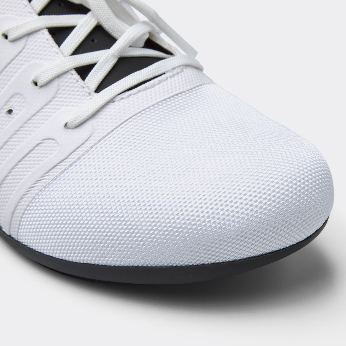 White road cycling shoe toe and textured upper with lace holes