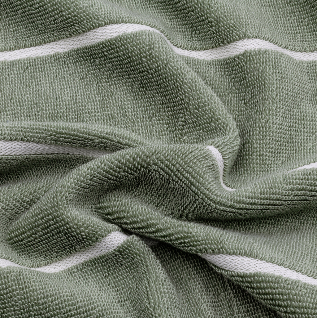 Sage green cotton towel with soft terry texture