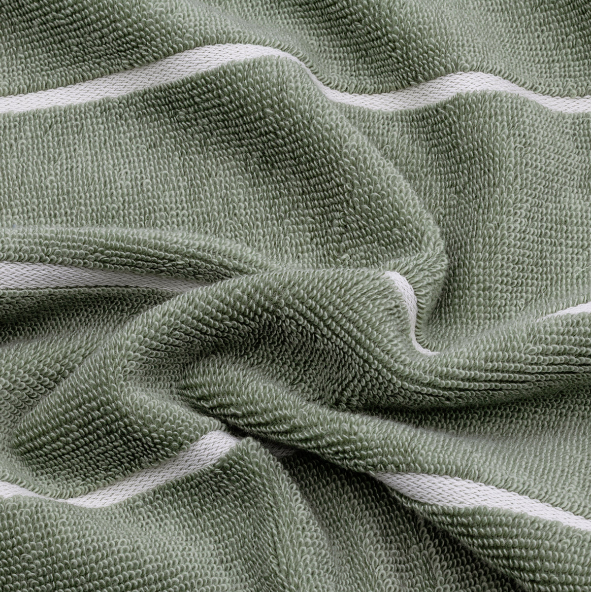 Sage green cotton towel with soft terry texture