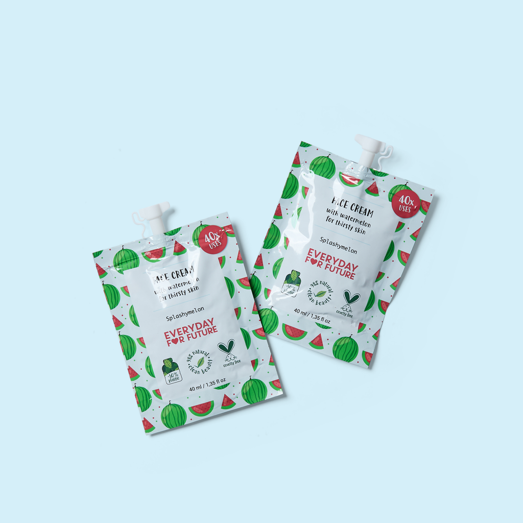 Everyday face cream pouches in white with green fruit pattern and red accents