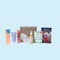Skincare gift box set with assorted creams, bottles, and pouch products
