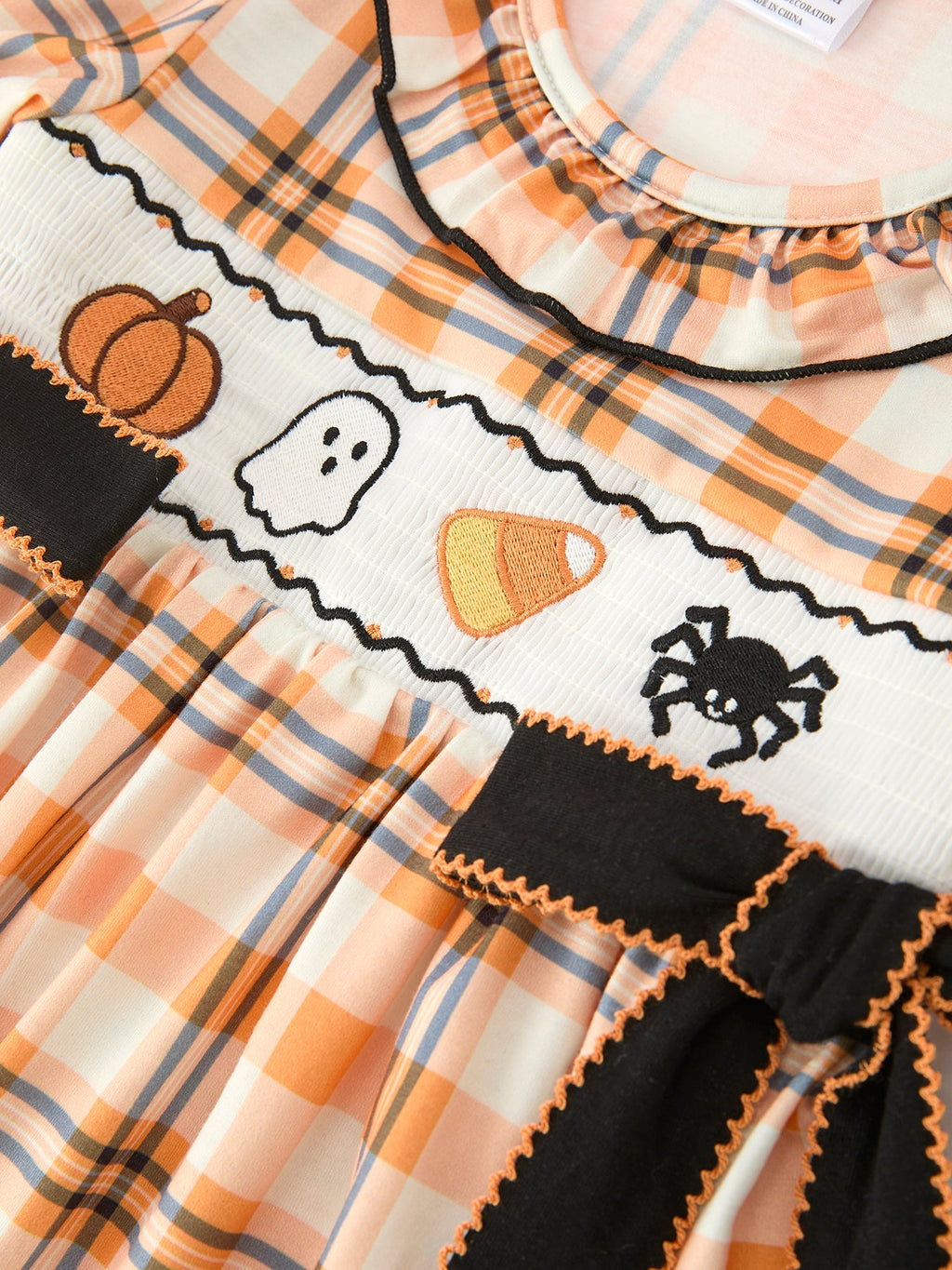 Halloween plaid girls dress with smocked bodice, pumpkin and ghost embroidery, black trim