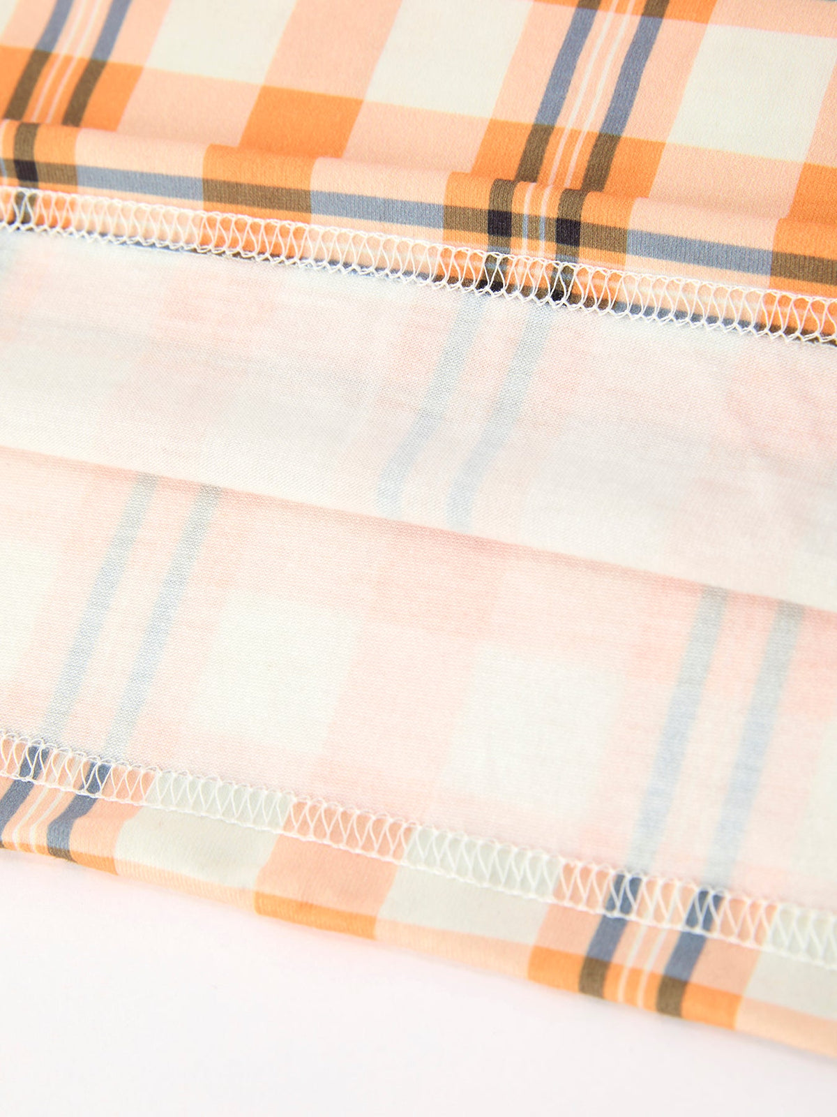Girls plaid Halloween dress with stitched gathered hem on orange and blue check