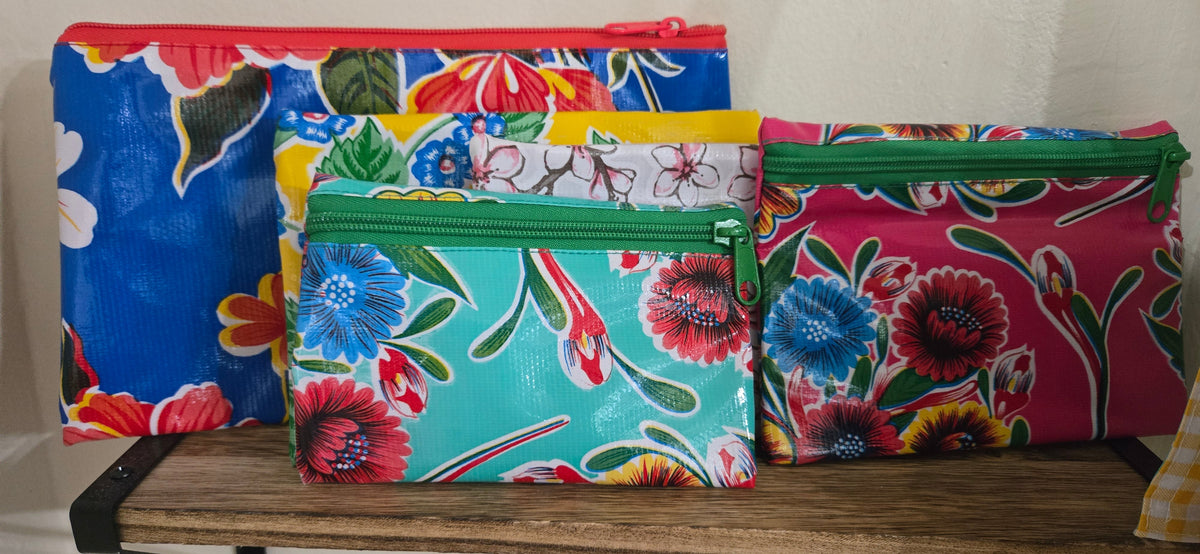 Floral zippered pouch set in mixed colors, including blue, teal and pink