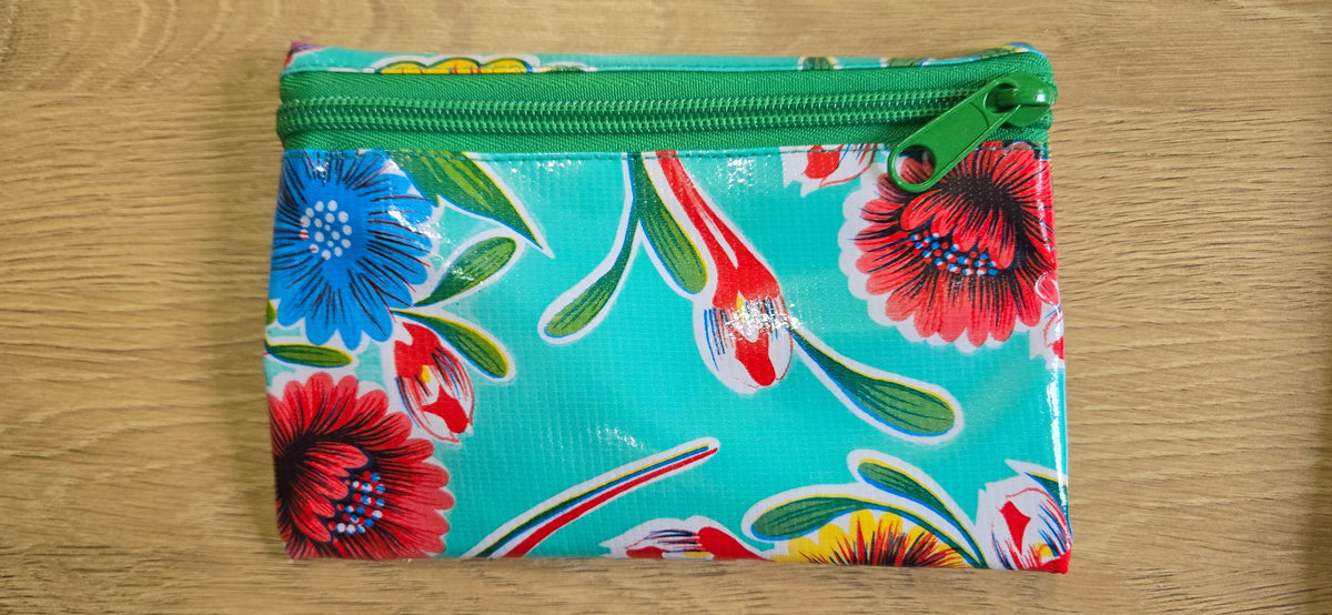Teal floral zippered pouch with green zipper, rectangular
