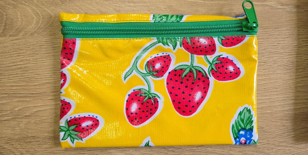 Yellow strawberry-pattern zippered pouch with green zipper