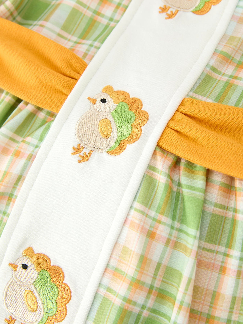 Girls plaid dress front panel with two turkey appliques and orange trim