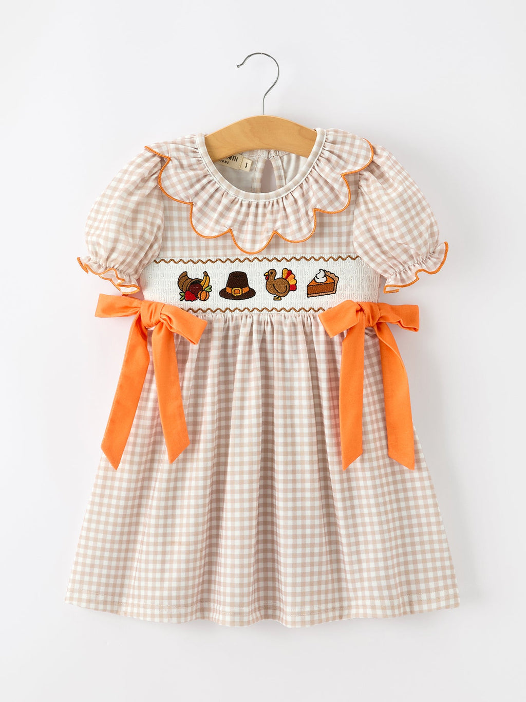 Toddler girls' Thanksgiving gingham dress on hanger, scalloped collar and orange bows
