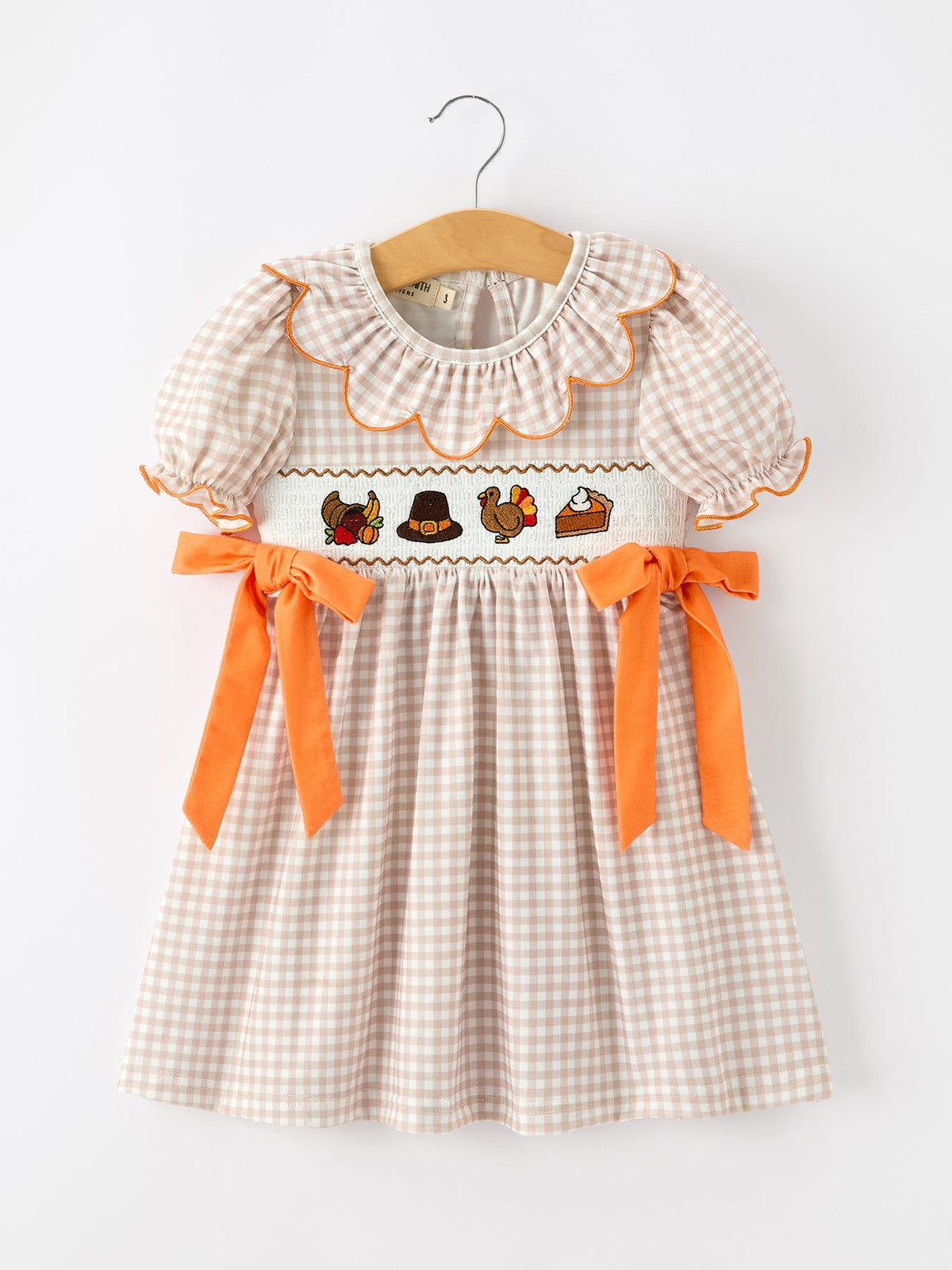 Toddler girls' Thanksgiving gingham dress on hanger, scalloped collar and orange bows
