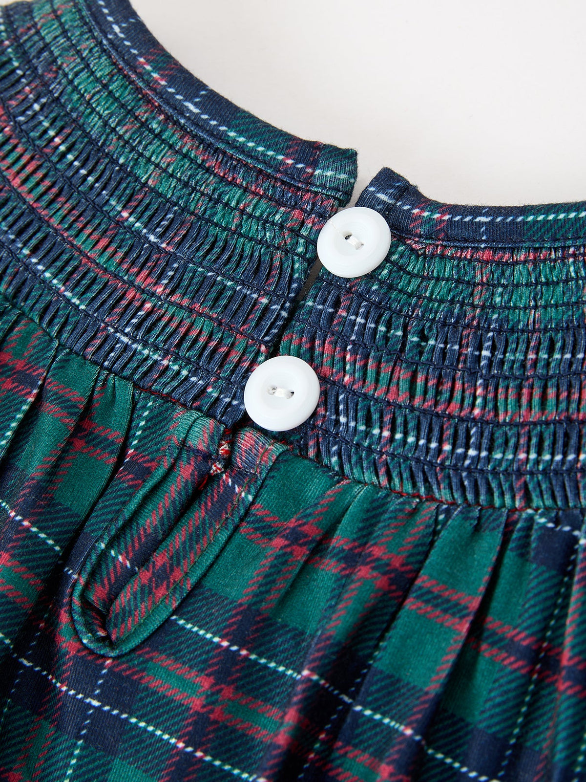 Girls plaid bubble romper with elastic smocking and white button front