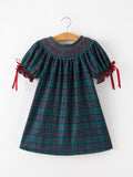 Plaid smocked dress with puff sleeves and red ribbon ties, teal and red check