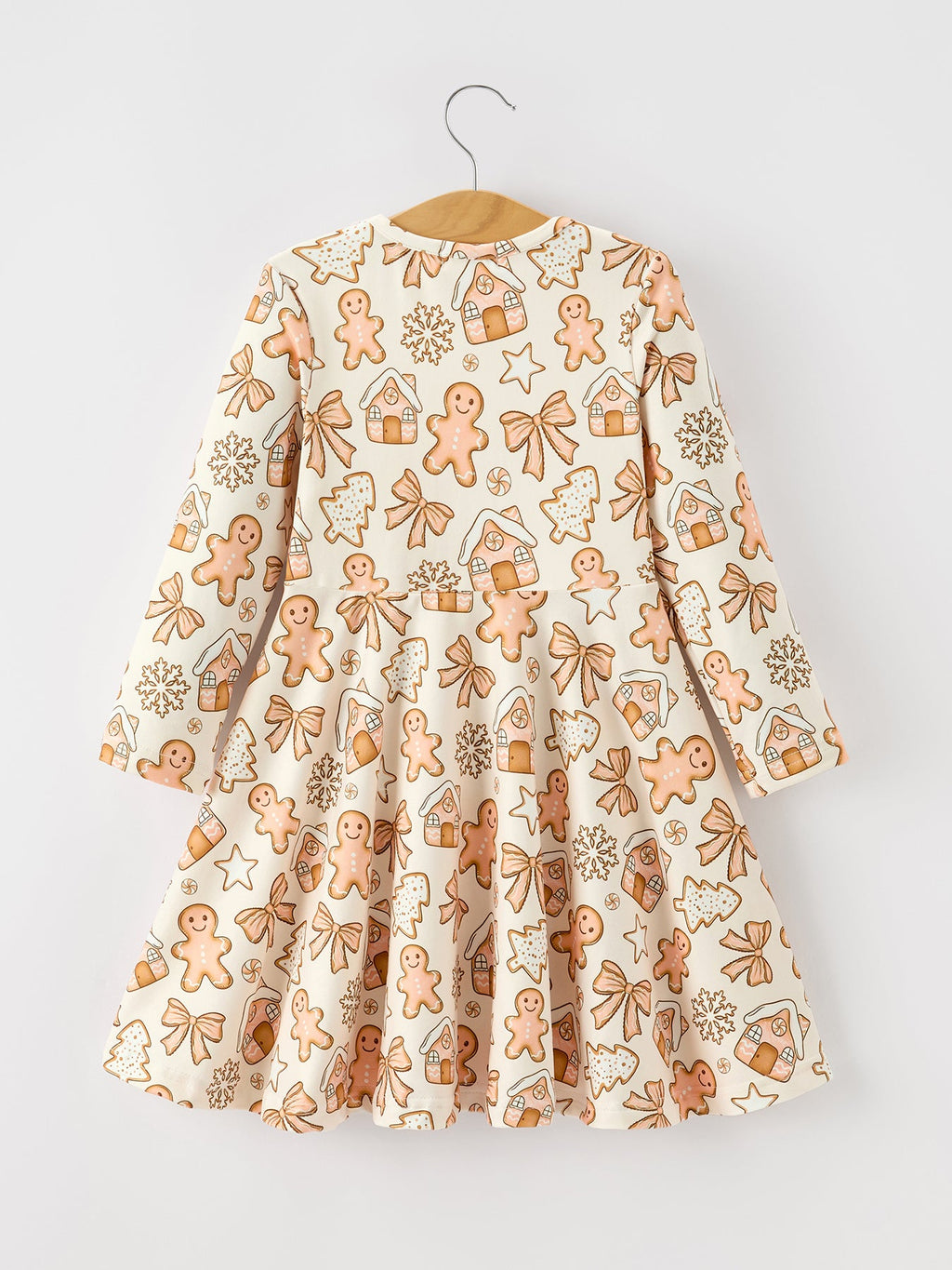 Girls long-sleeve twirl dress on hanger, cream with gingerbread cookie pattern