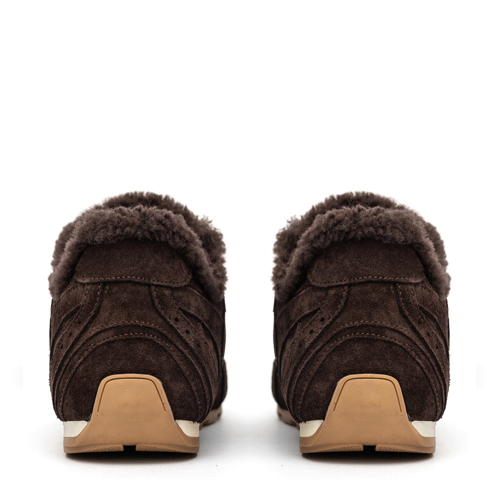 Brown suede shearling sneakers, back view with tan heel and fuzzy collar