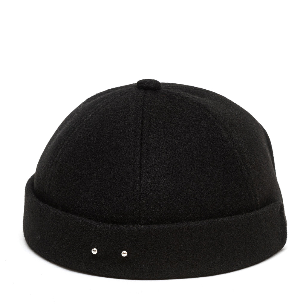 Black docker cap top view with centered seam and two metal studs