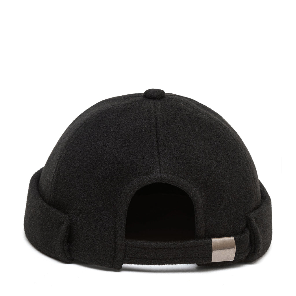 Black docker cap back view with adjustable strap and metal buckle