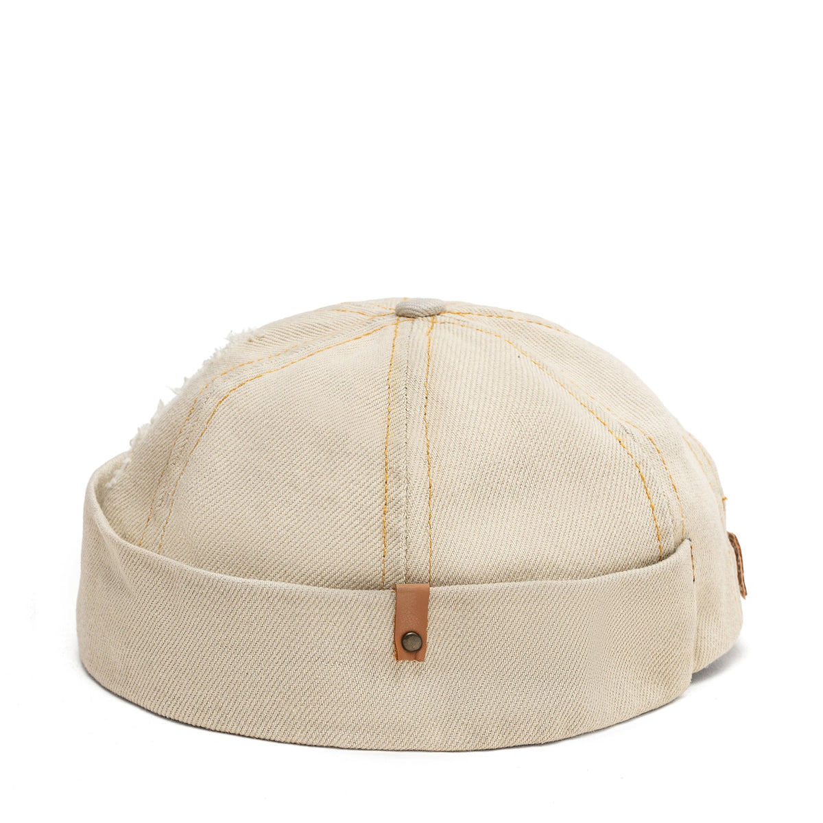 Beige canvas Docker-style cap top view with vertical stitching and brown button tab