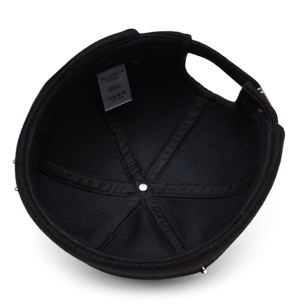 Black docker cap with studded eyelets and stitched panels