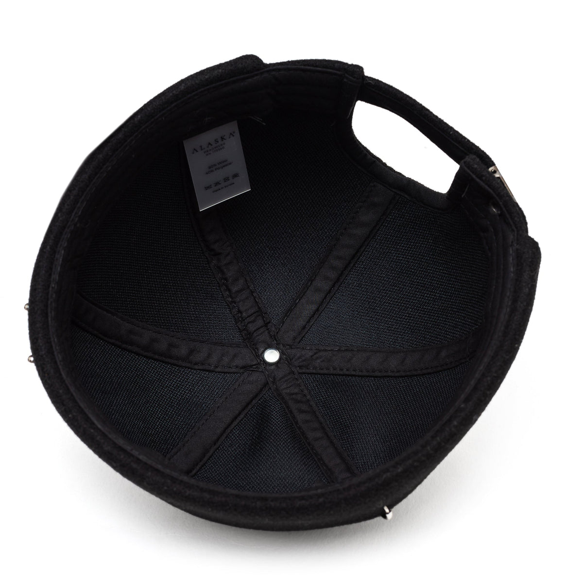 Black docker cap with studded eyelets and stitched panels