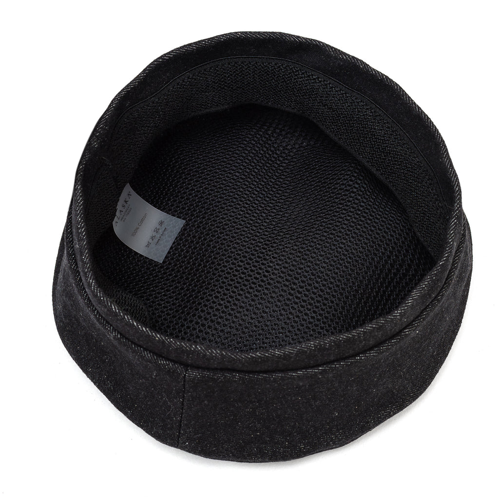 Black beret with lined interior and stitched brim edge