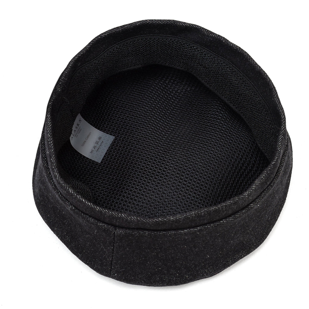Black beret with lined interior and stitched brim edge