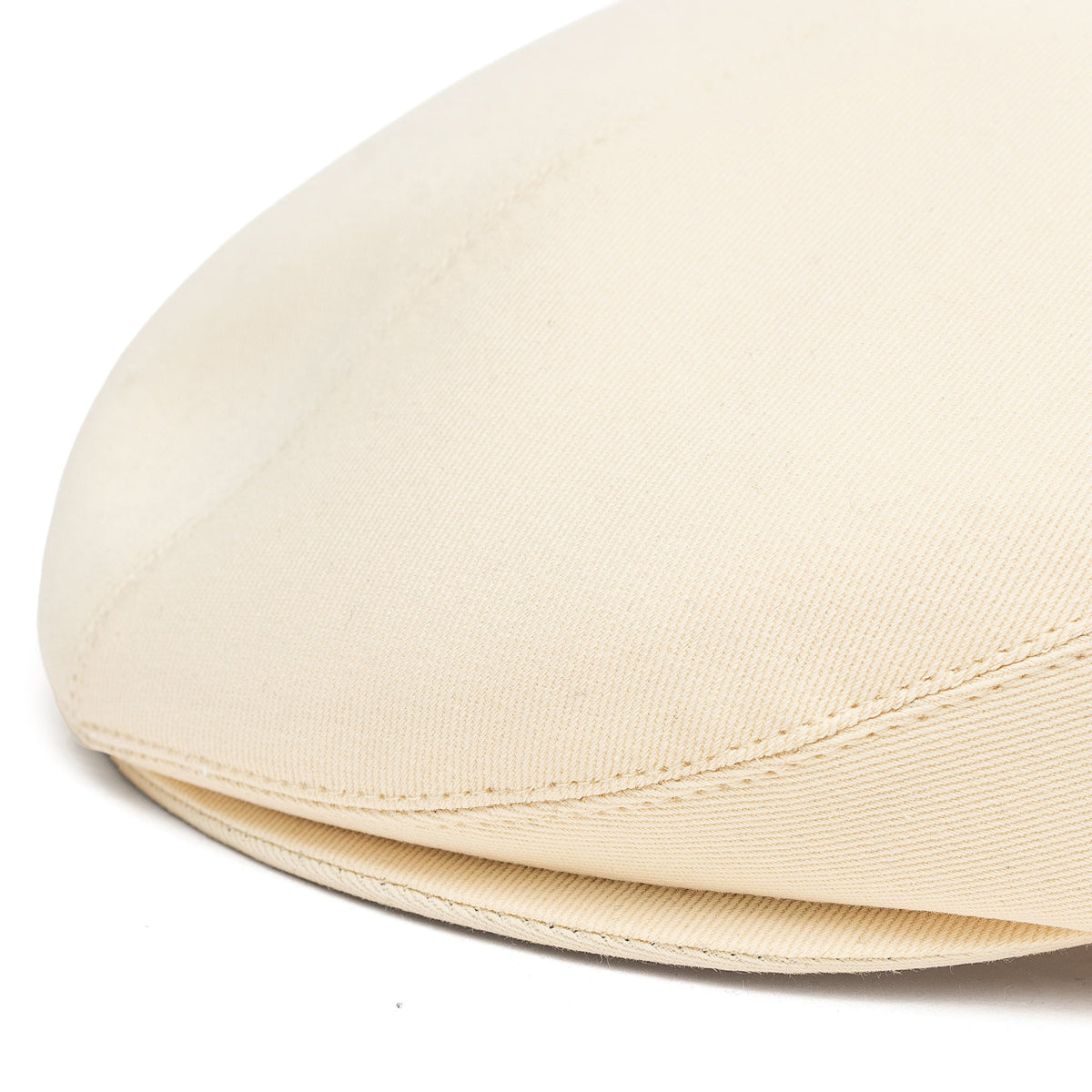Ivory cotton cap hat with curved brim and visible fabric weave