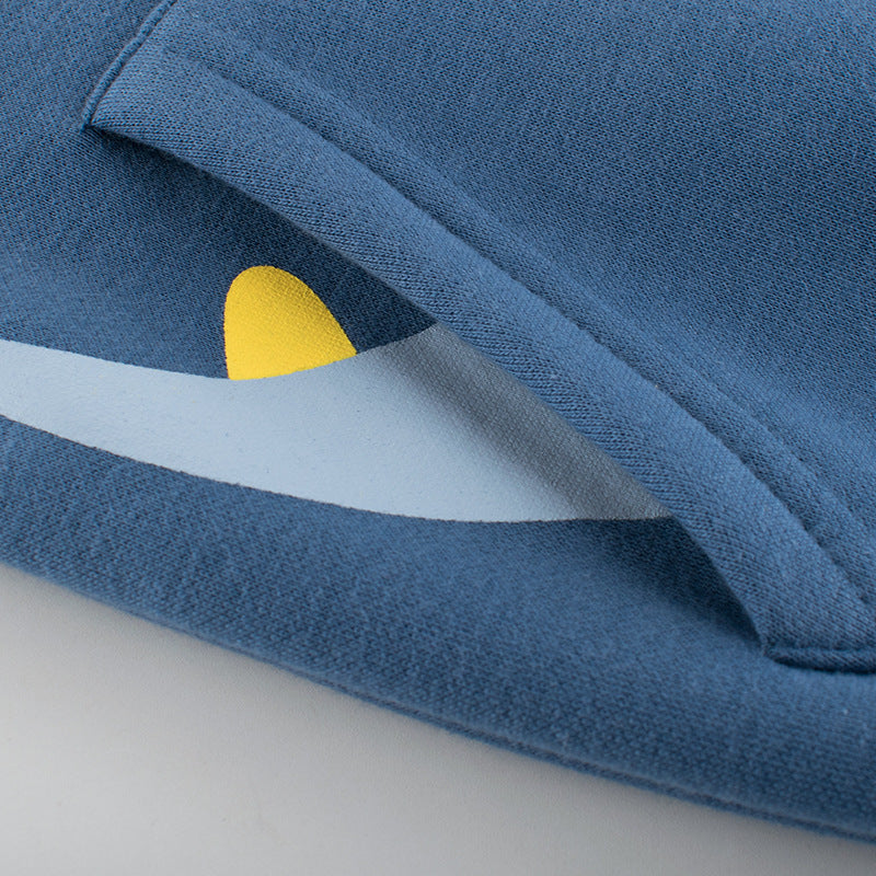 Blue fleece jacket sleeve close-up with cuff seam and textured fabric