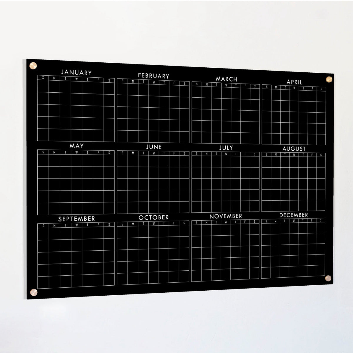 Black acrylic yearly calendar board with horizontal monthly grid and corner grommets