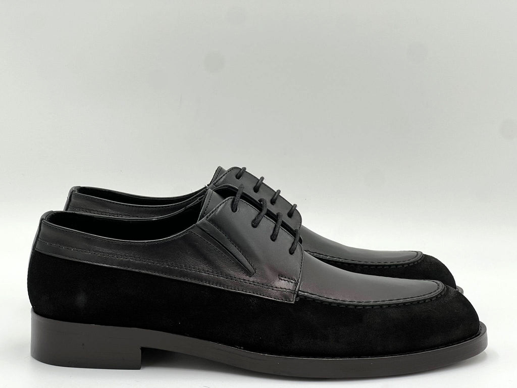 Black leather oxford single shoe, lace-up style with low block heel.