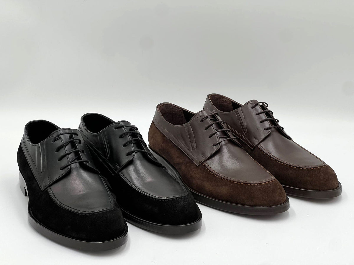 Leather oxford shoes shown in black and brown, lace-up with stitched panels.