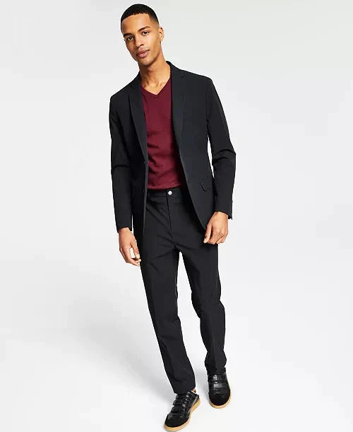 Men's black slim-fit sport coat and matching trousers, worn with burgundy crewneck