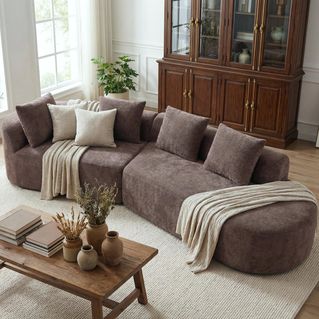 Brown curved sectional sofa with backrest cushions and four matching square throw pillows