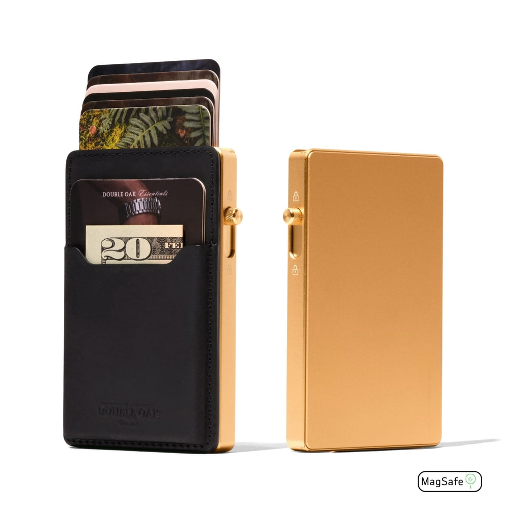 Mod wallet with black leather front and gold metal back plate, side view