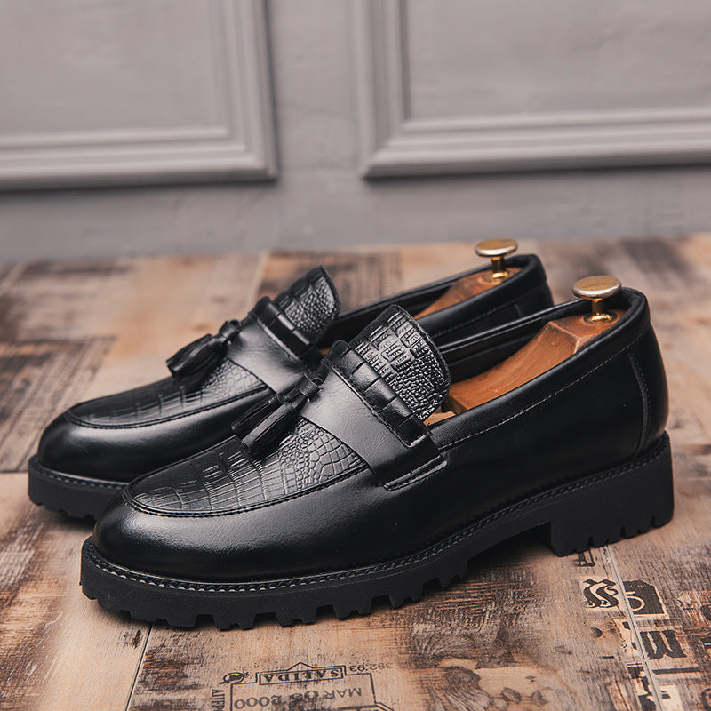 Men's leather loafers with tassel detail, black with patterned side strap and chunky sole