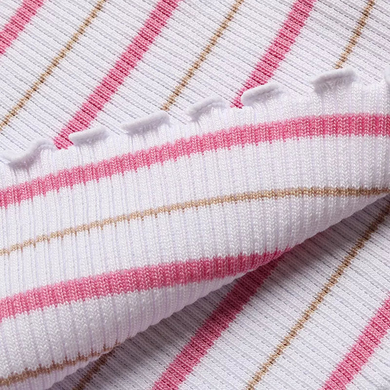 Close-up of white ruffled trim and pink/tan stripes on knitted tube top