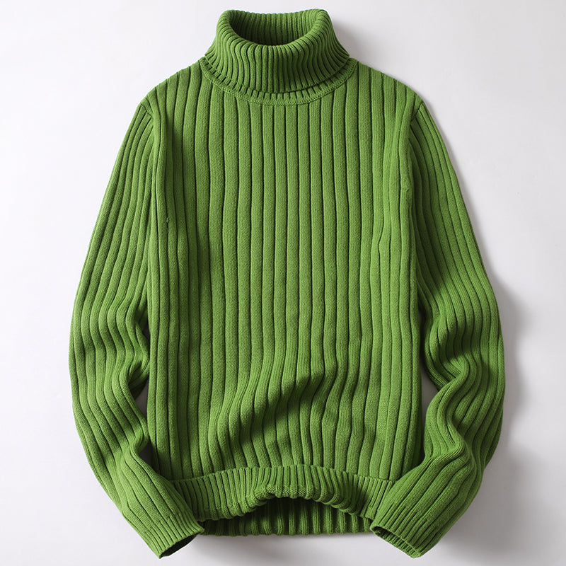 Green ribbed turtleneck sweater with long sleeves and folded knit collar.