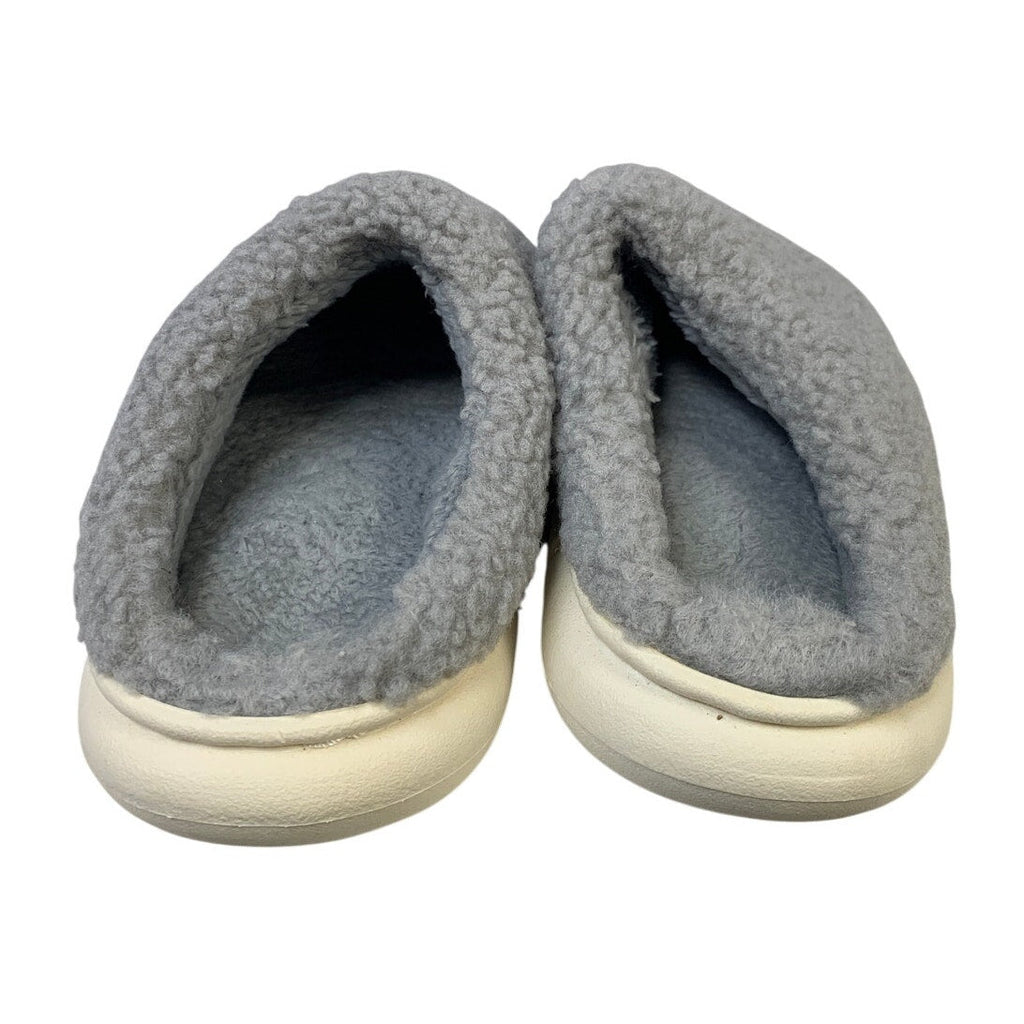 Gray fuzzy slippers with round toe and visible dark interior lining