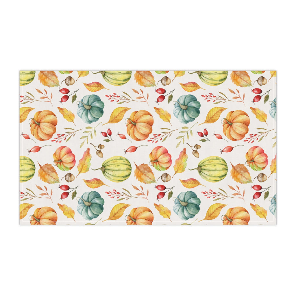 Cream autumn harvest tea towel featuring pumpkins, gourds, and red berries in repeating print.