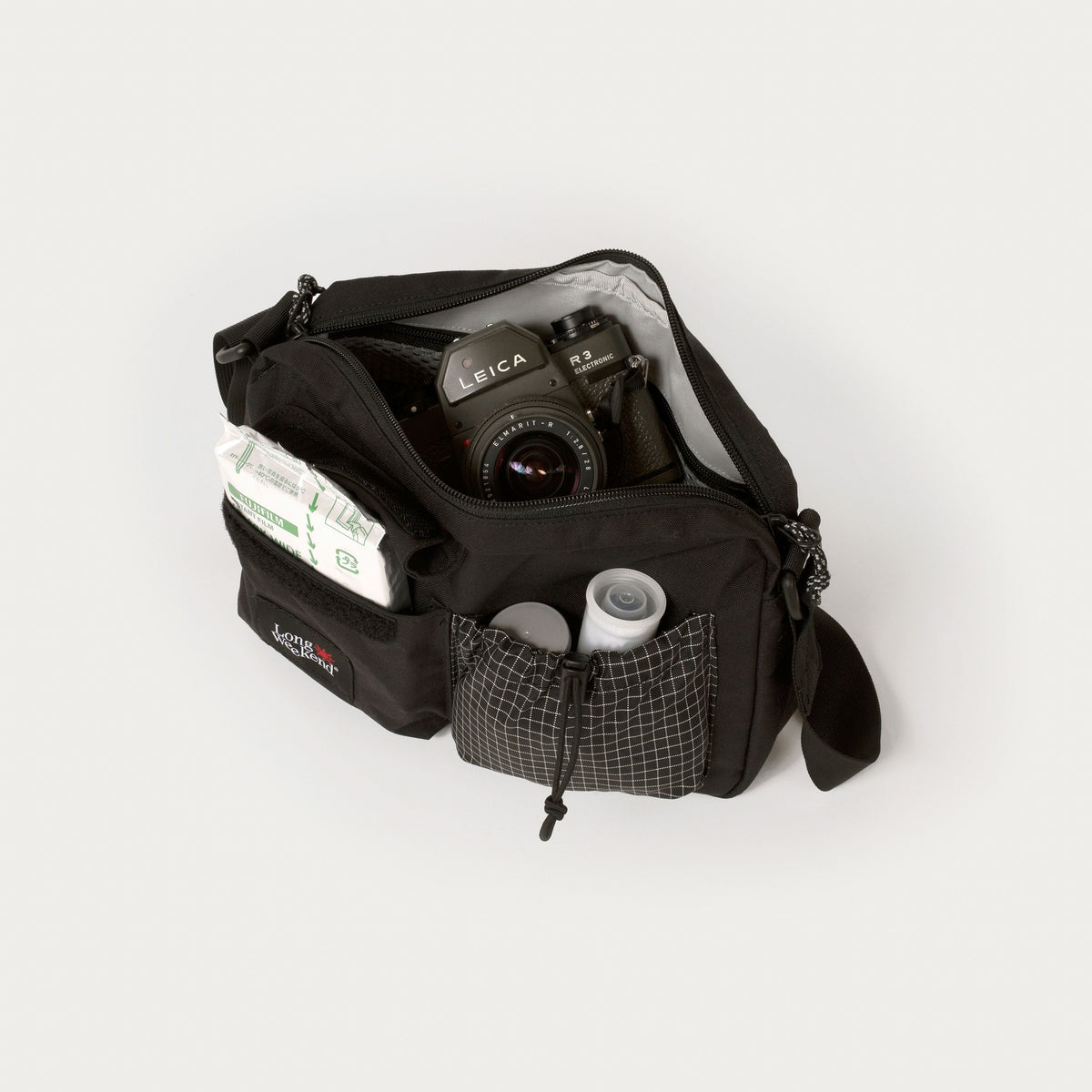 Black shoulder bag with zip compartments and camera storage, Long Weekend patch