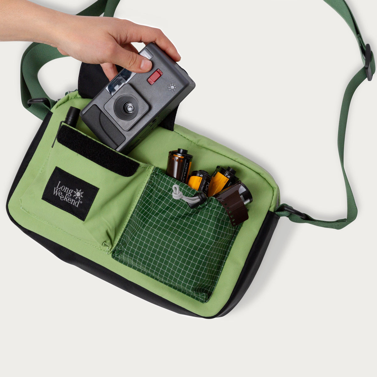 Green shoulder bag with front zip pocket and organizer panel, Long Weekend patch
